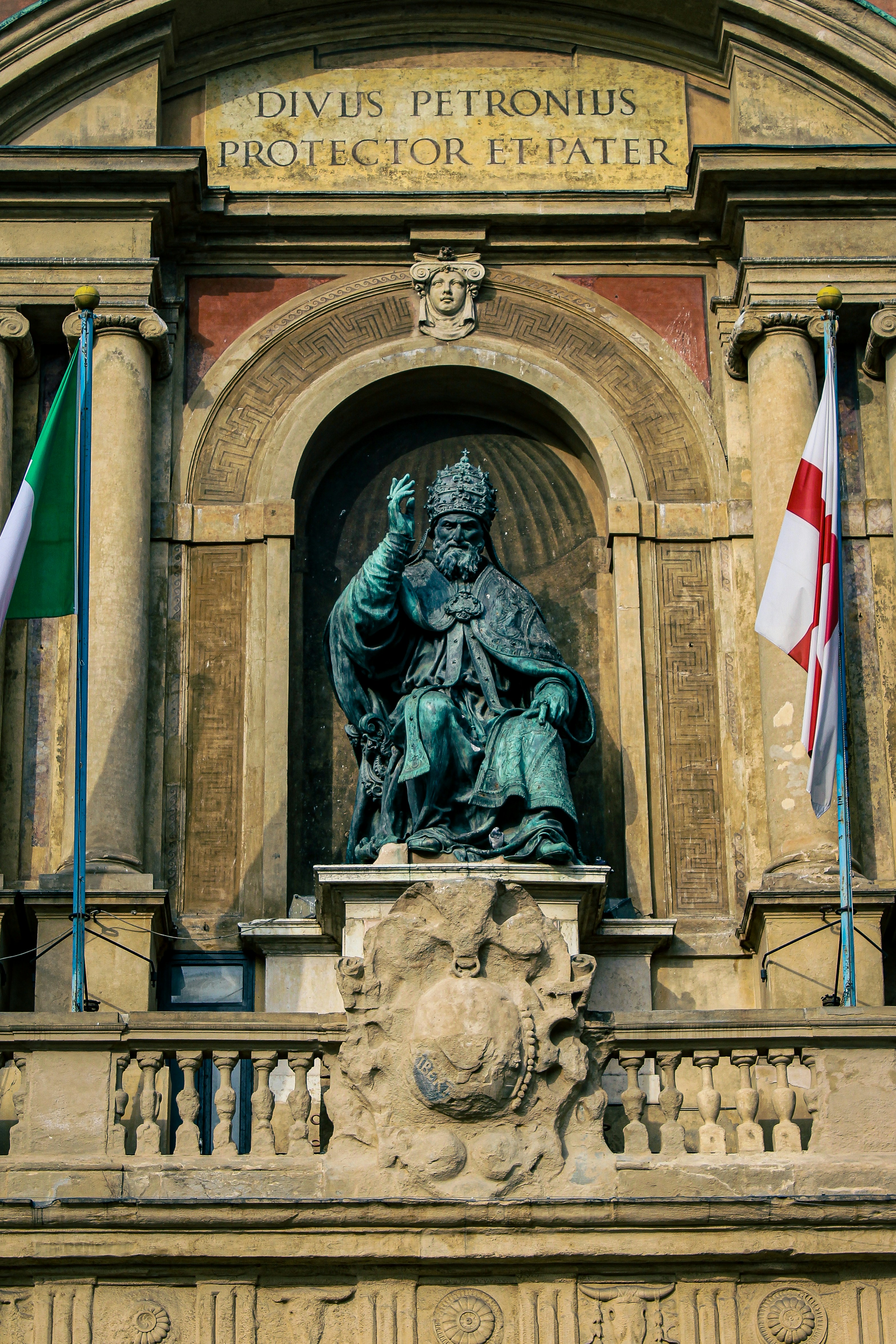 a statue of a person with flags