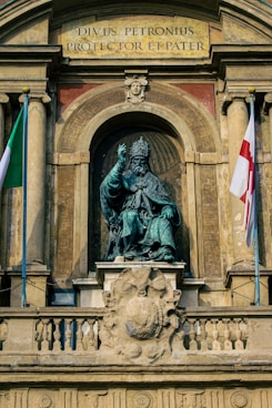 a statue of a person with flags