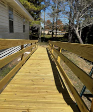 A newly installed wheelchair ramp leading to a cozy home entrance.