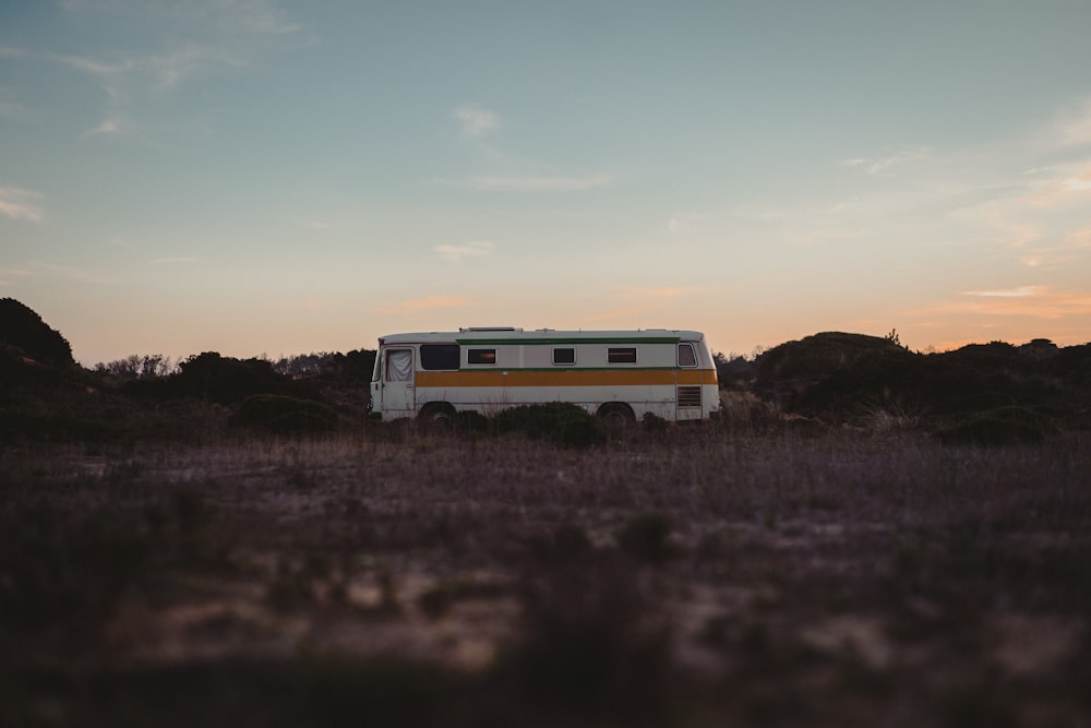 a bus parked in a field