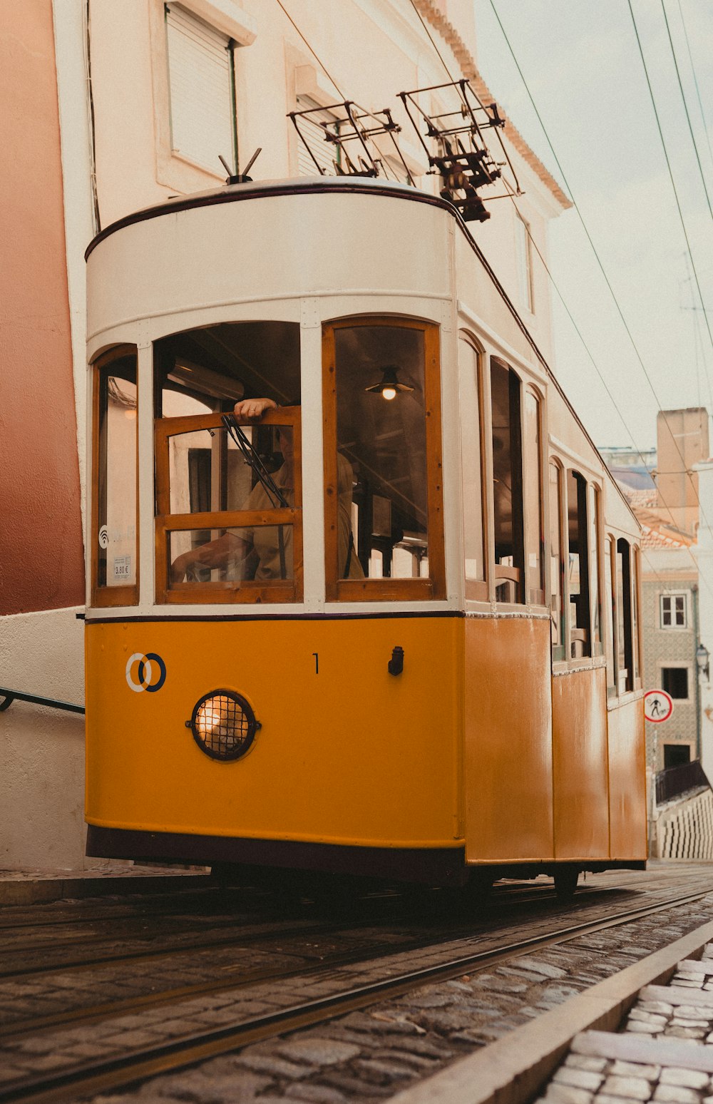 a yellow trolley car