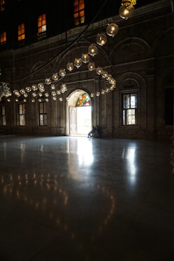 A stately Masonic lodge hall bathed in warm light, showcasing classic symbols and rich woodwork.