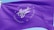 A vibrant purple flag with the words 'Agenda Edu' prominently displayed in the center in a cursive font. Surrounding the central text are the words 'Simplificamos Jornadas Educacionais' arranged in a circular pattern. The flag waves gently, creating ripples in the fabric against a clear blue sky.