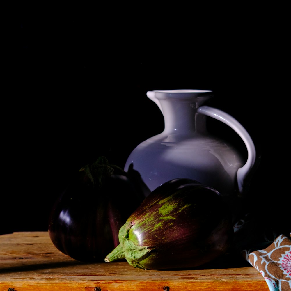 a teapot and a pitcher on a table