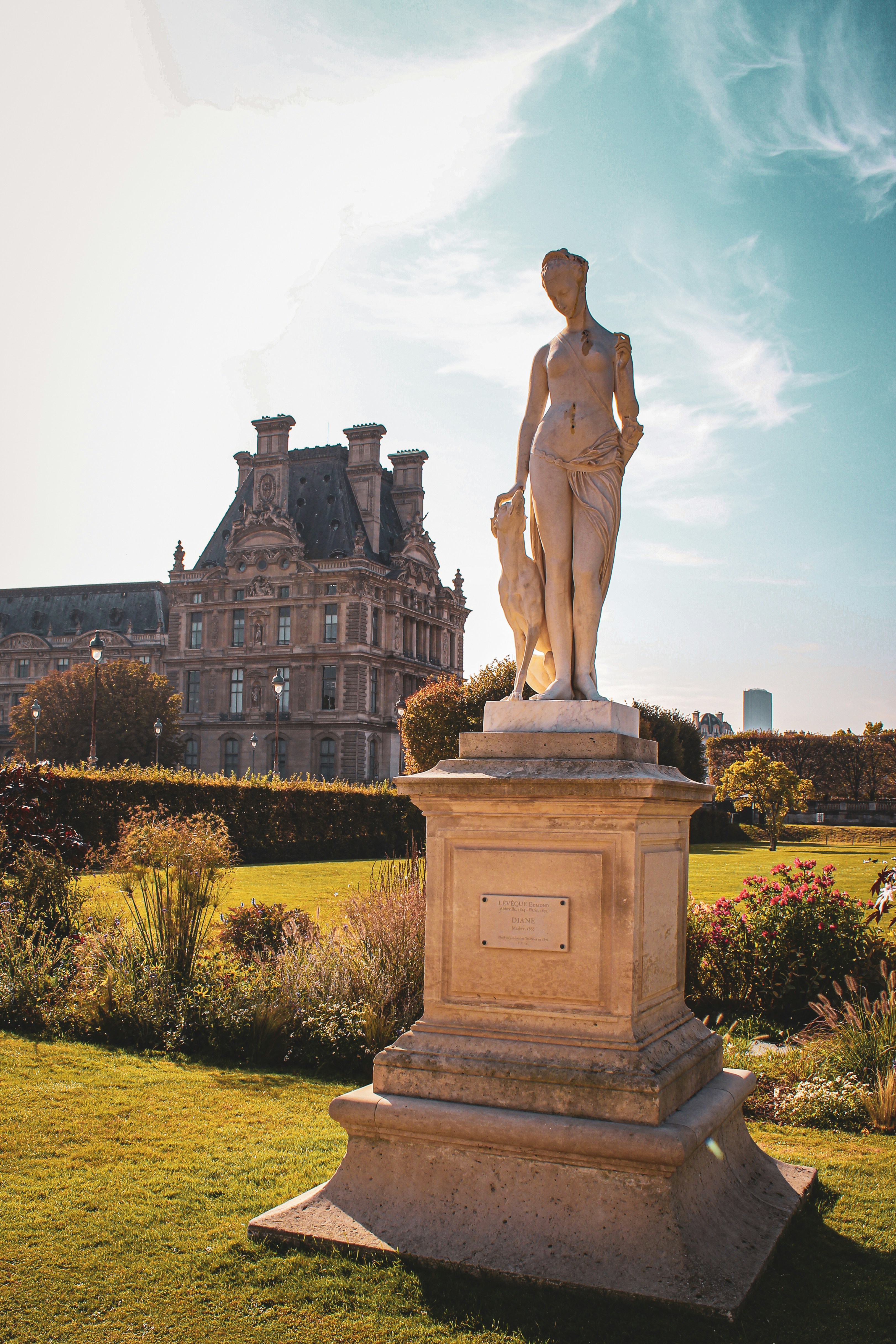 a statue in front of a building