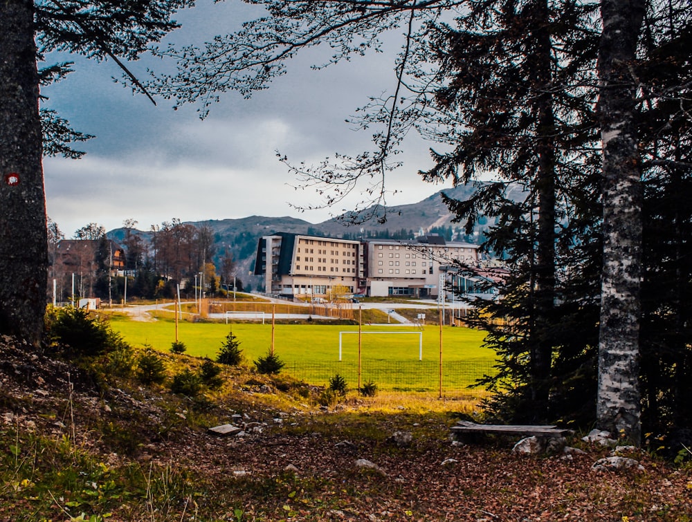 a building with a field in front of it