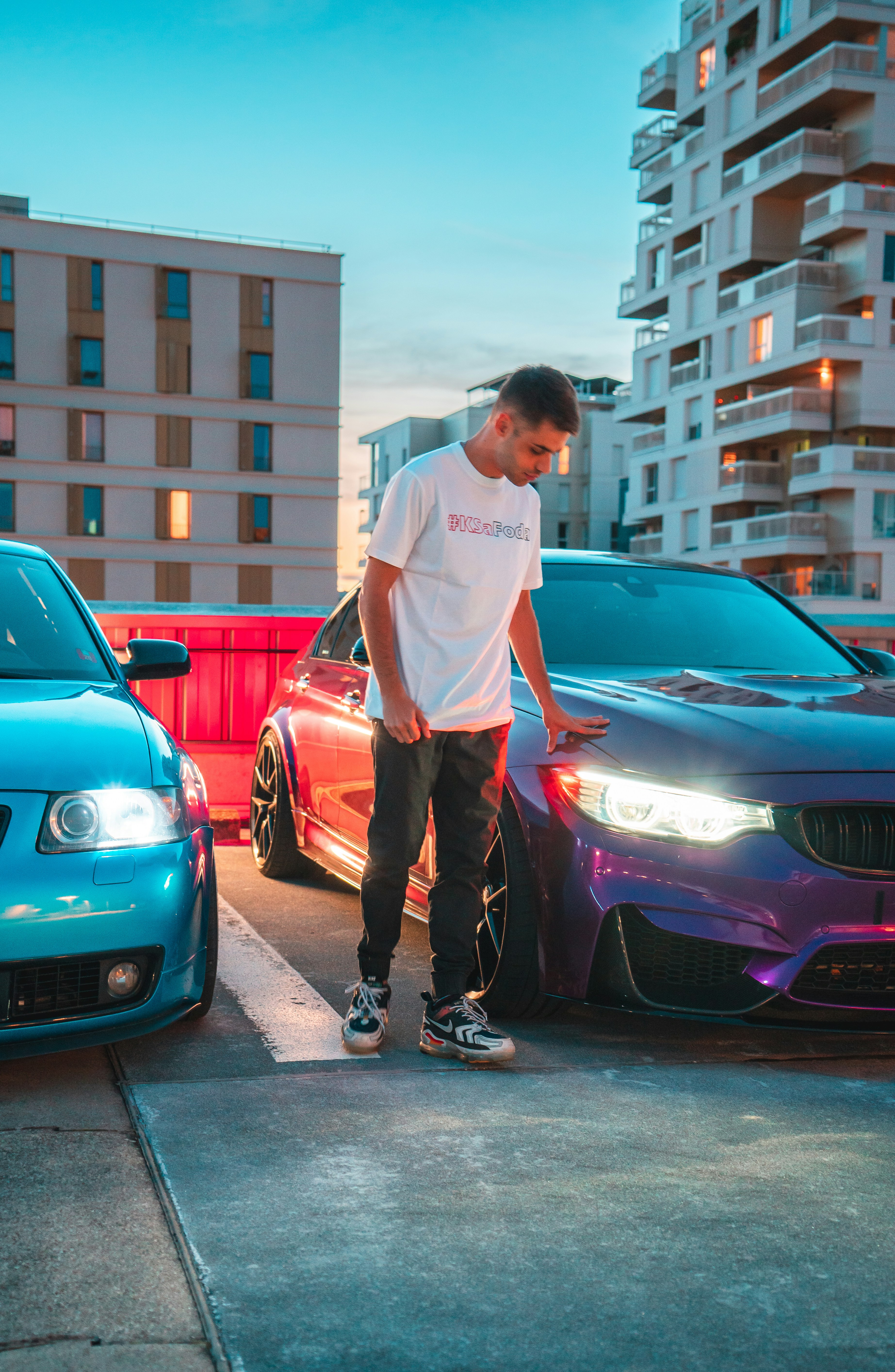 a man standing next to a car