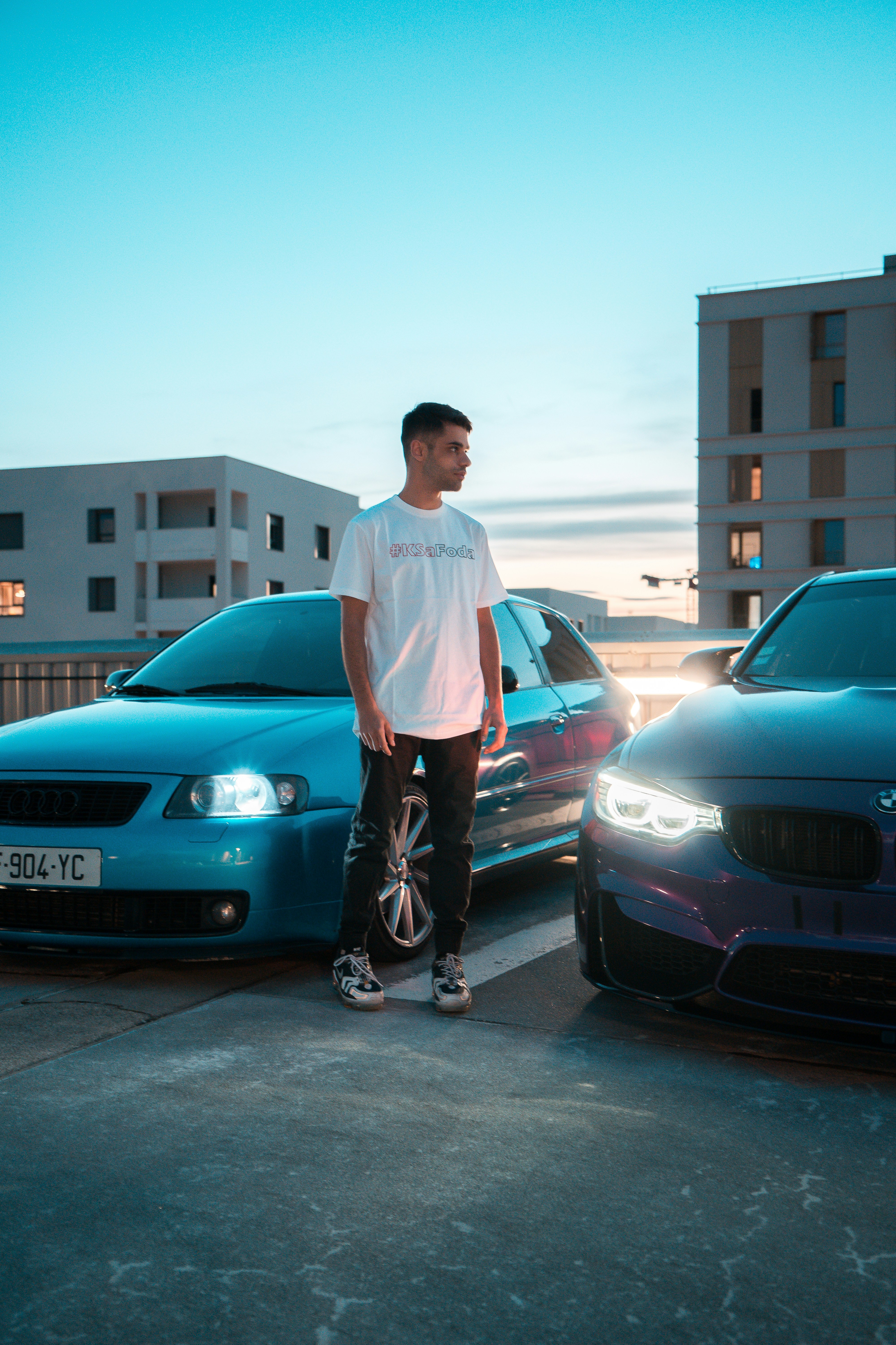 a man standing next to a car