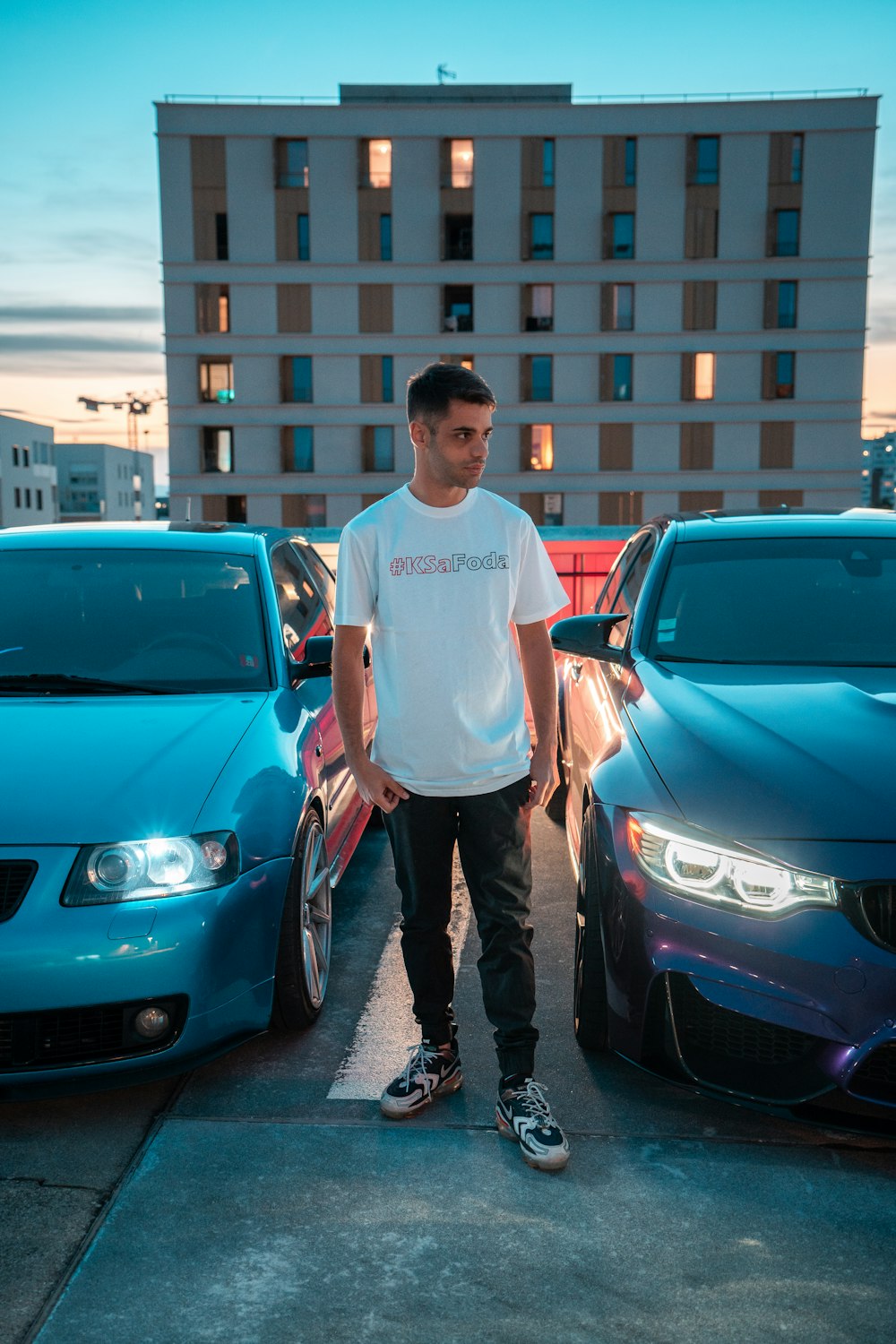 a man standing next to a car