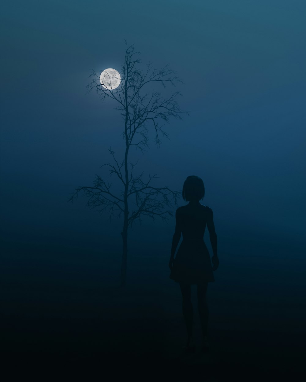a person standing in front of a tree at night