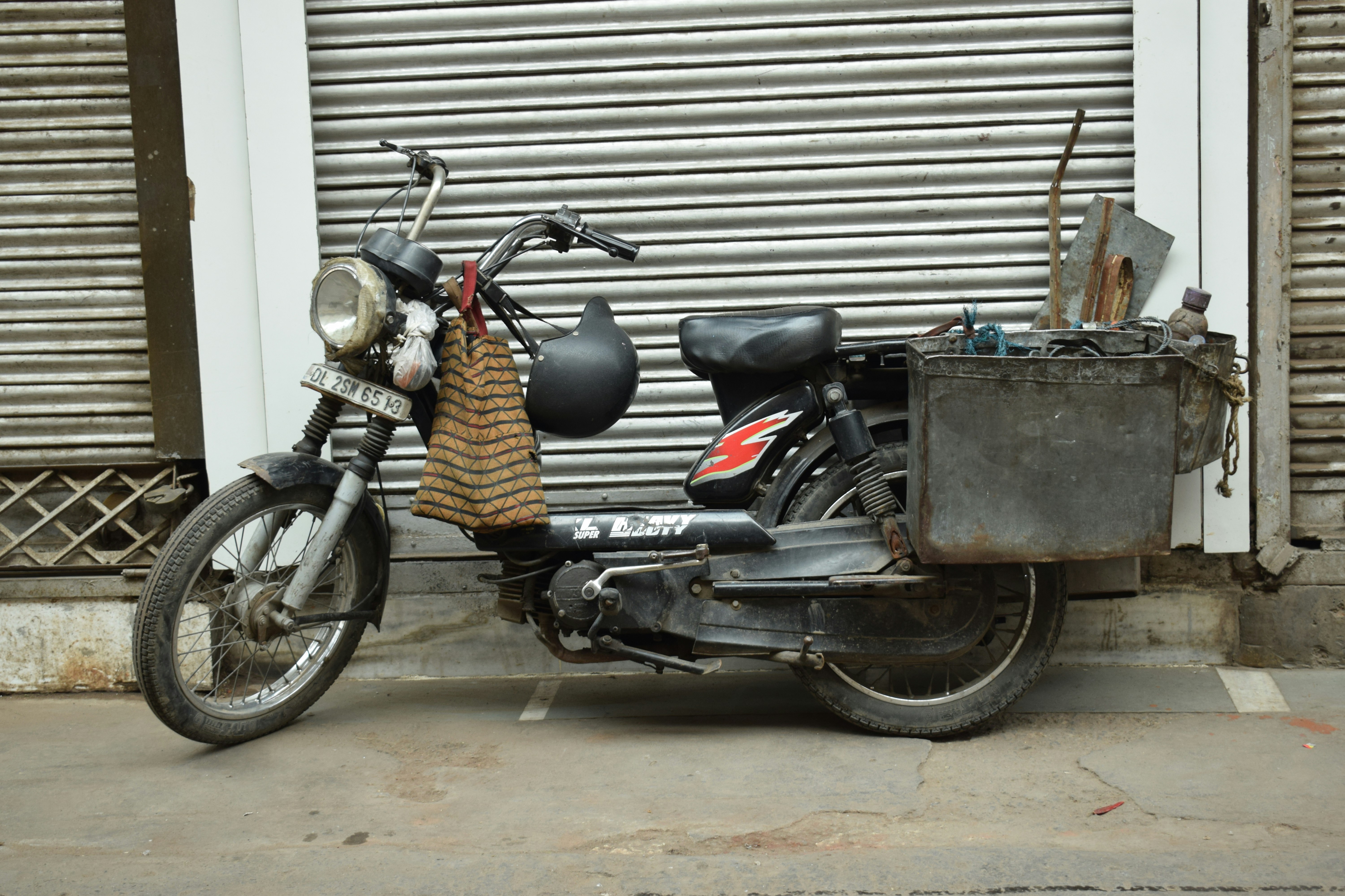 a motorcycle parked in front of a garage door