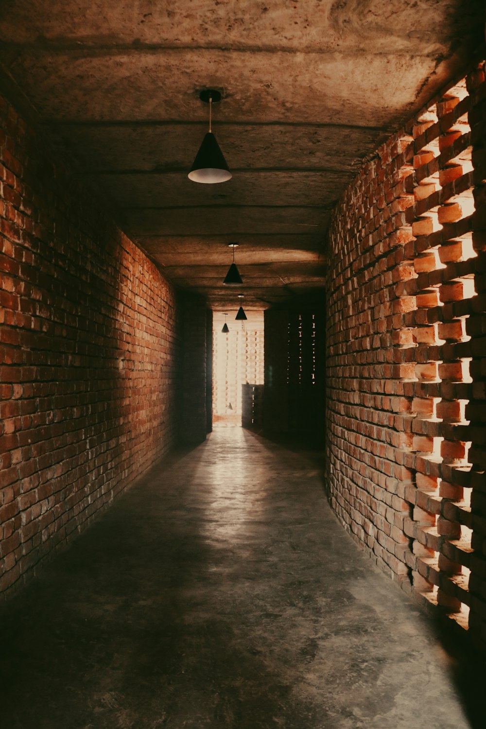 a hallway with brick walls