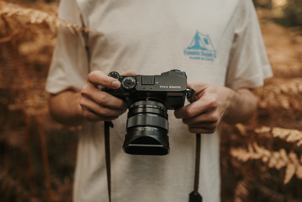 a person holding a camera