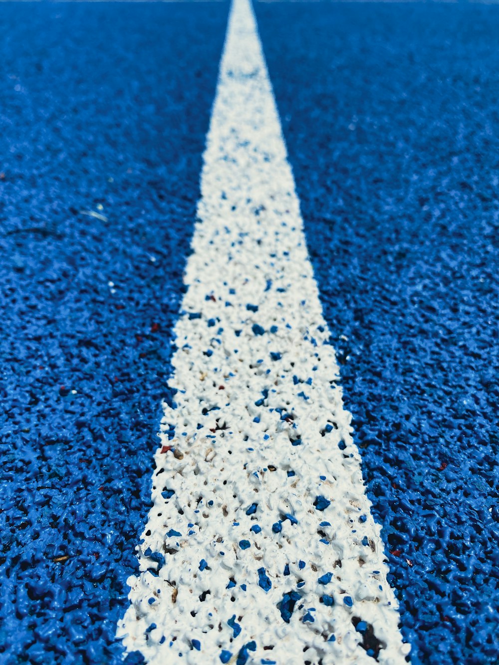 a snowflake on a blue surface