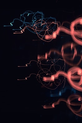Abstract light trails symbolizing data flow and automation in marketing.