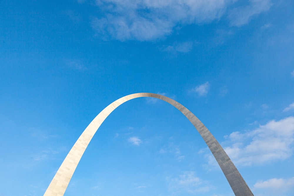 a large arch with a blue sky