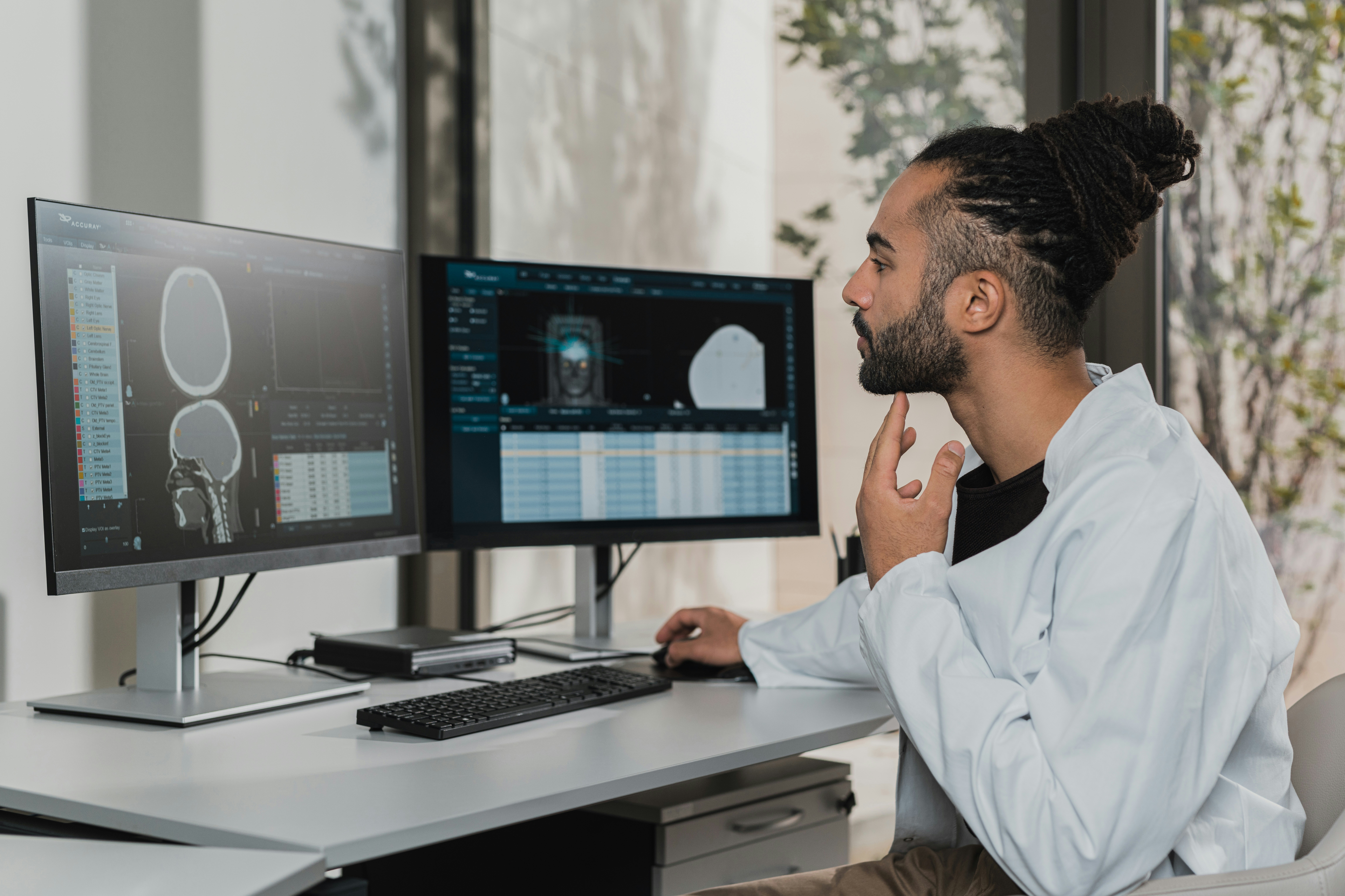 software engineer examining machine learning neural network weights visualization on monitor