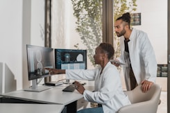 A healthcare professional reviewing medical charts in a bright, welcoming office.