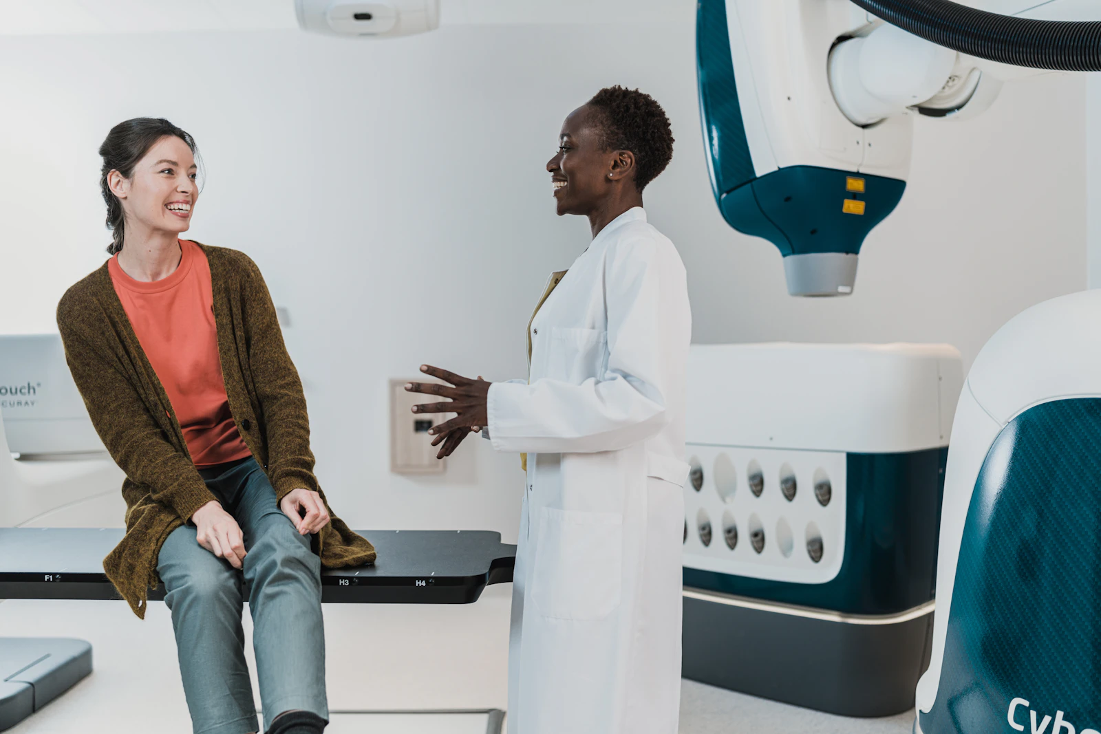A doctor and patient talking in an exam room
