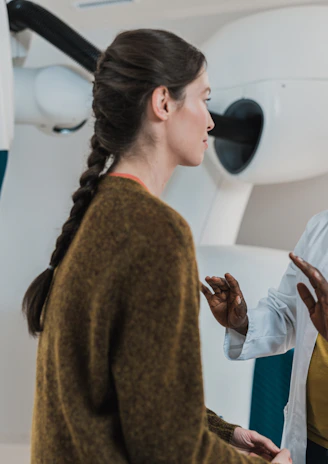 Photo of a healthcare professional consulting with a female patient, symbolizing gynaecology.