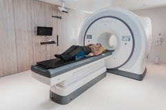 a person lying on modern MRI Machine