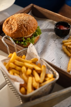 a burger and fries on a tray