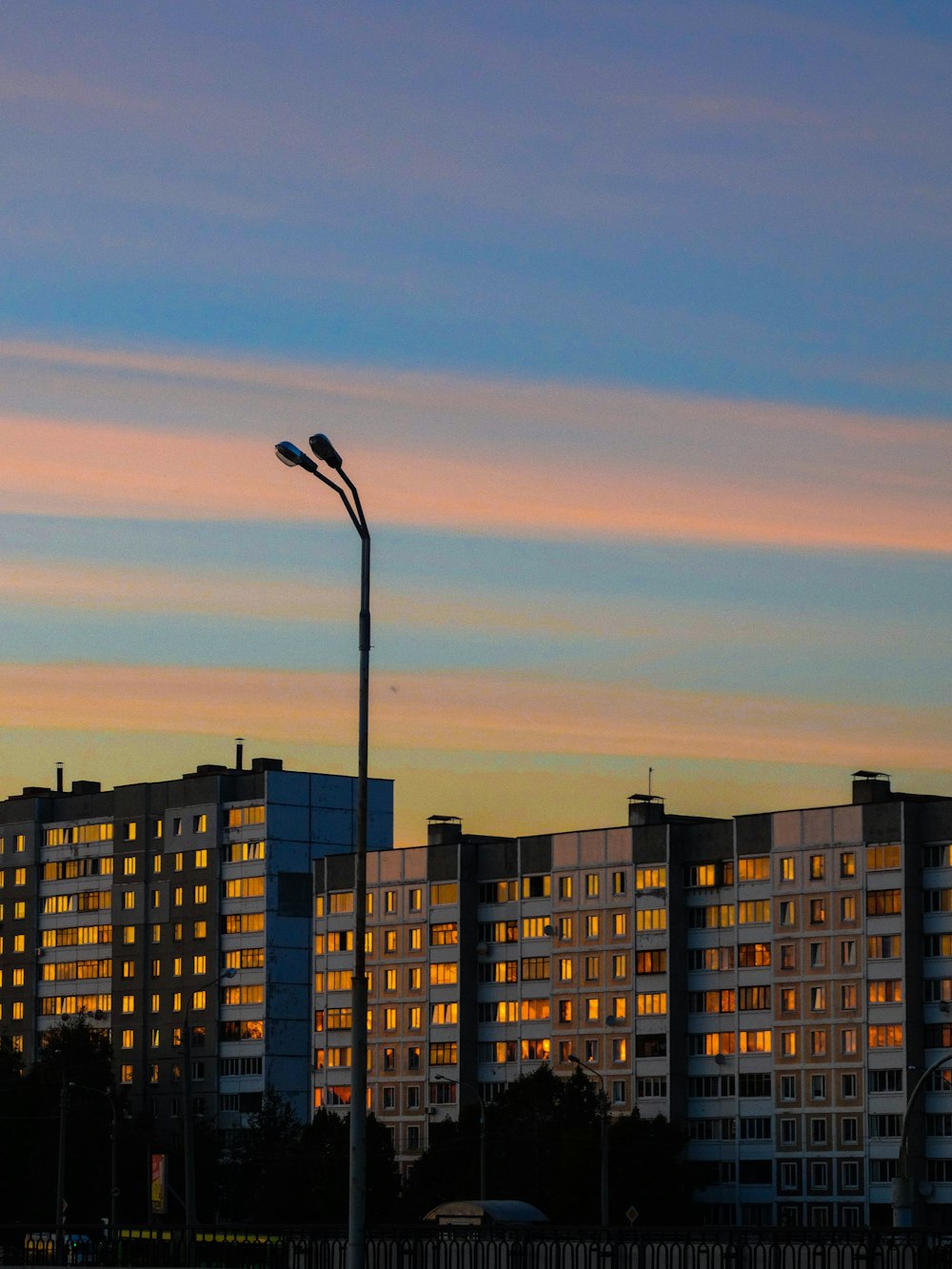 a building with a sunset in the background