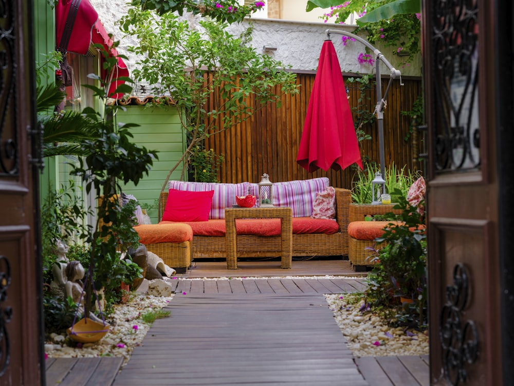 a patio with a couch and chairs