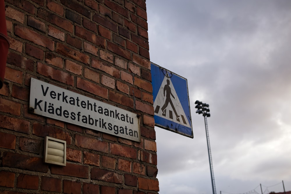 a sign on a brick building