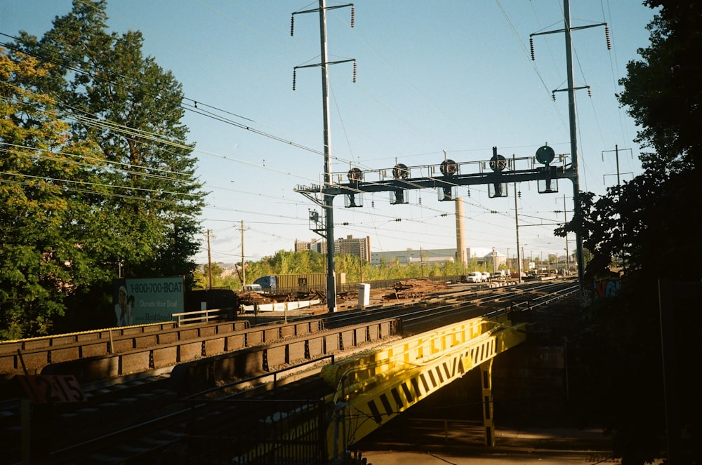 train tracks with a sign over it