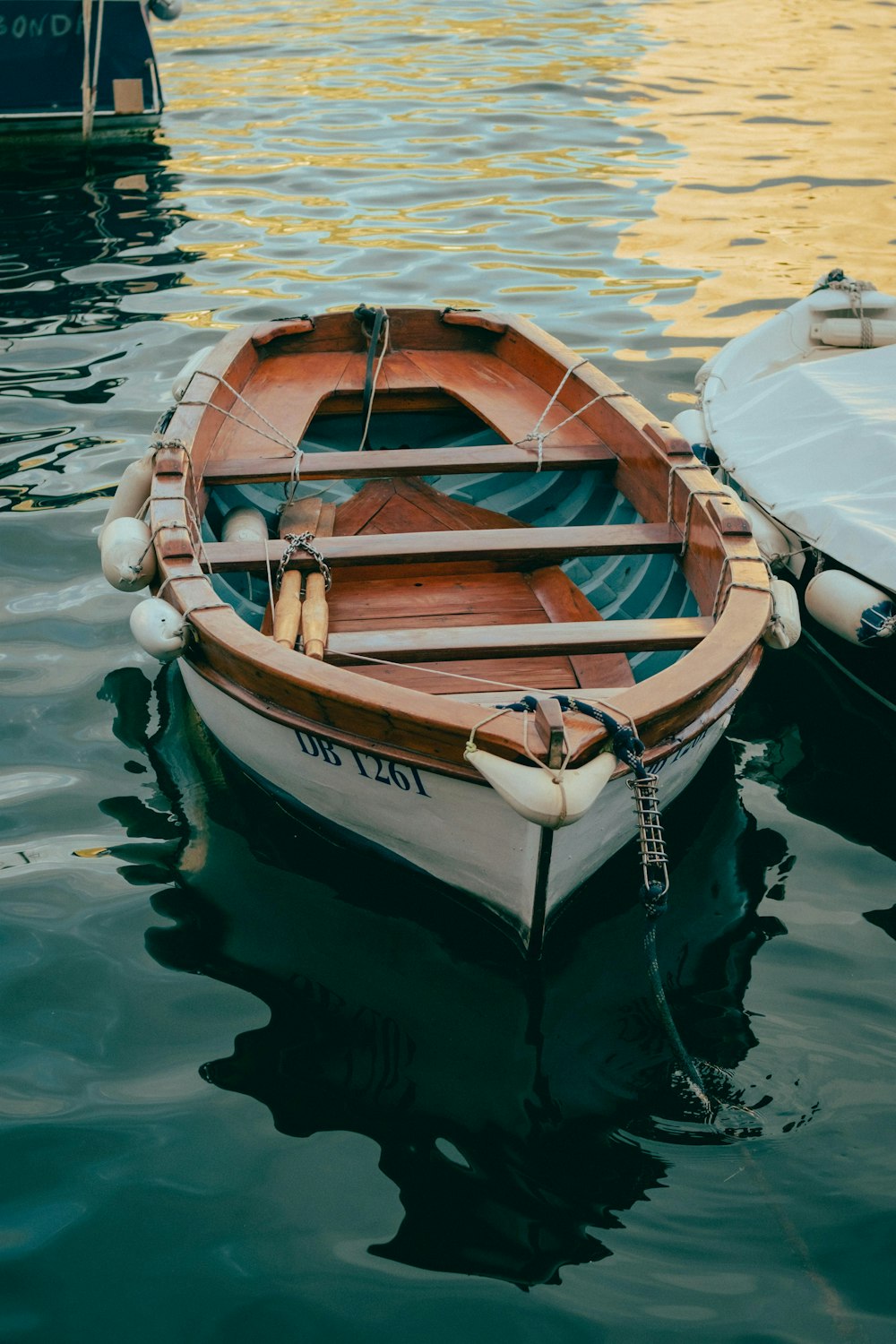 a couple of boats sit in the water