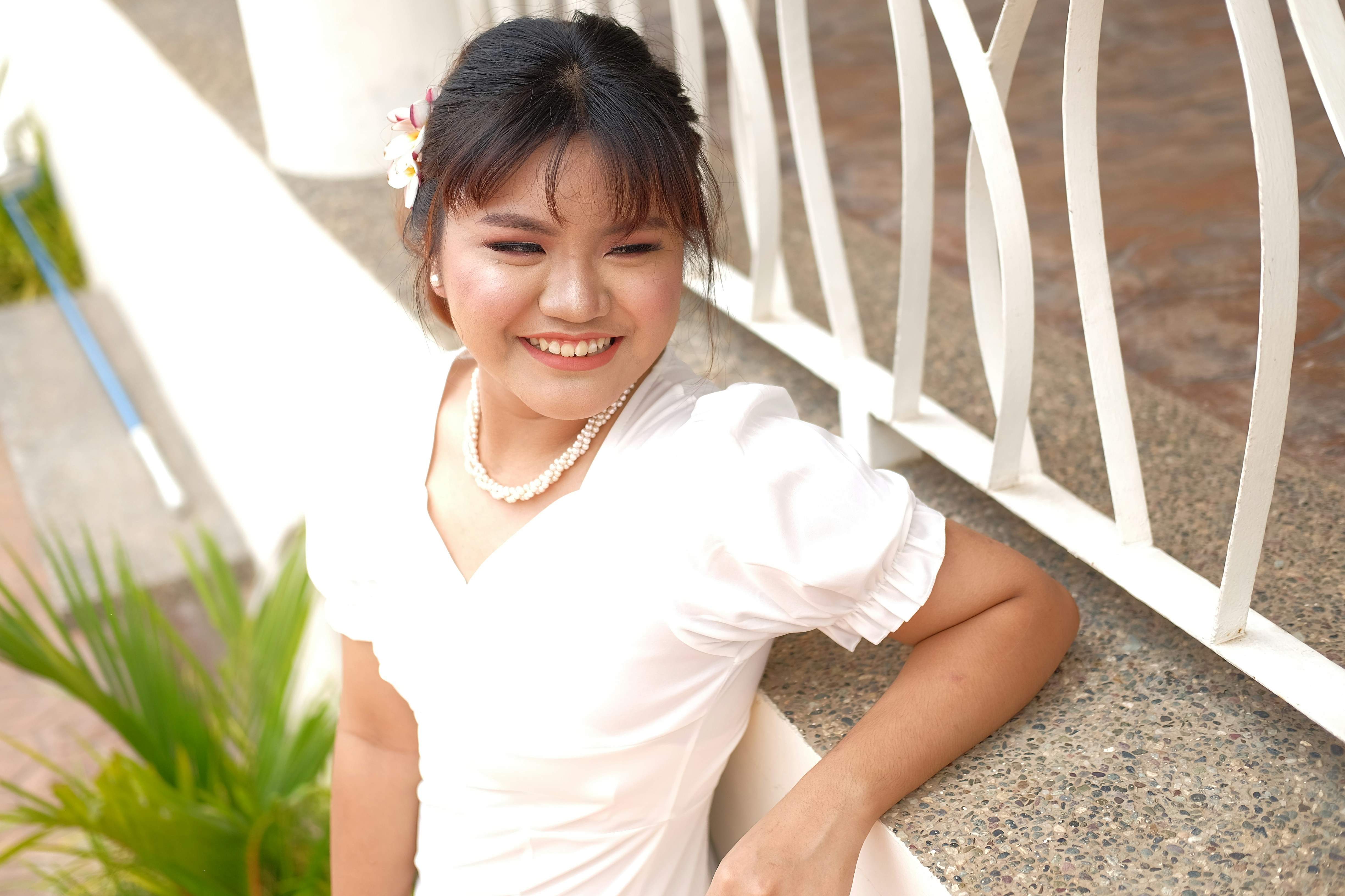a person sitting on a fence