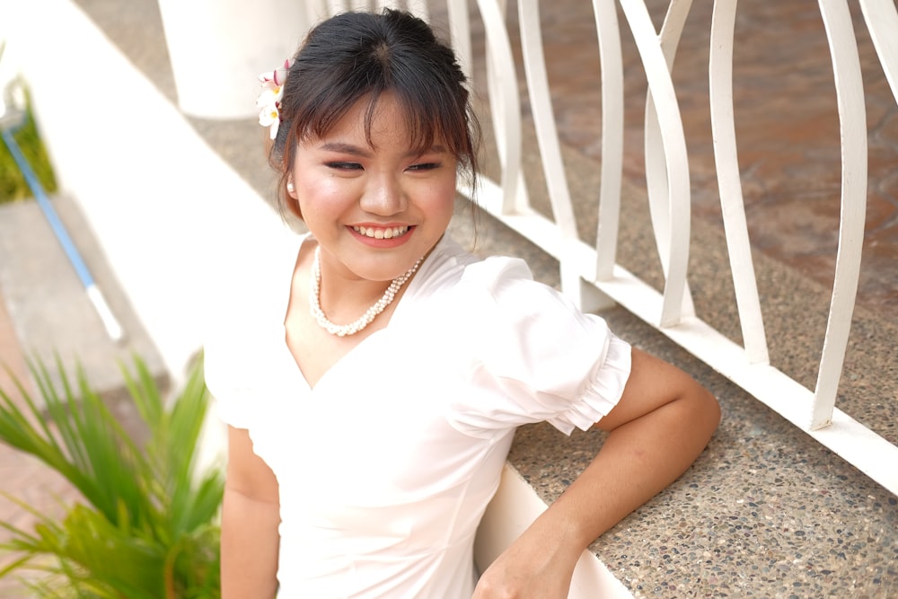 a person sitting on a fence