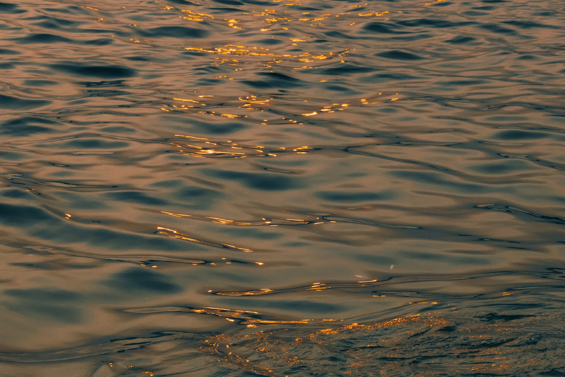 a body of water with a sunset