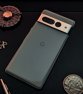 a cell phone with a coin and a coin on the side