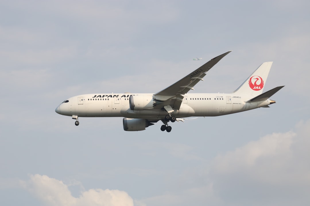 a large airplane flying in the sky,