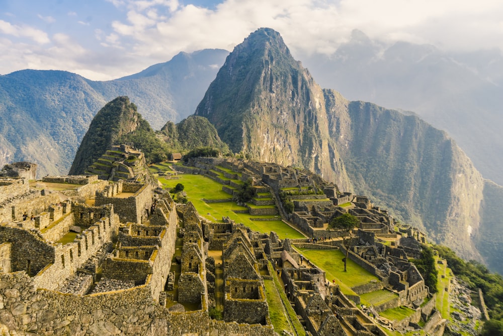 a large ancient city with Machu Picchu in the background