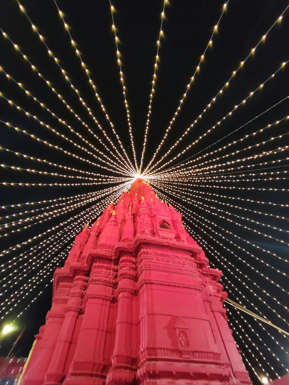 a large red bridge with lights