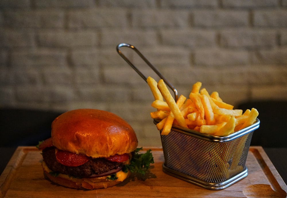 a burger and fries on a table