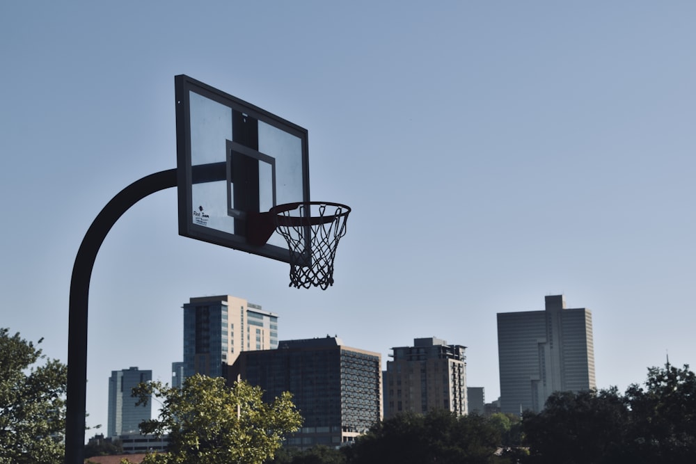 basketball hoop with a basketball hoop in front of a city