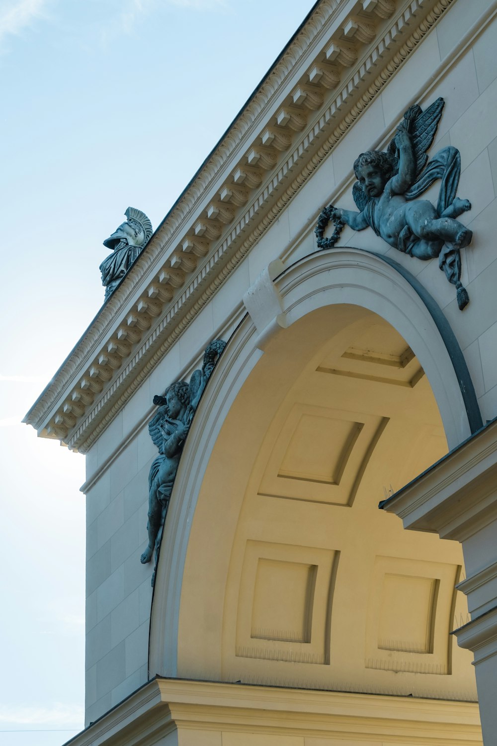 a building with statues on the roof