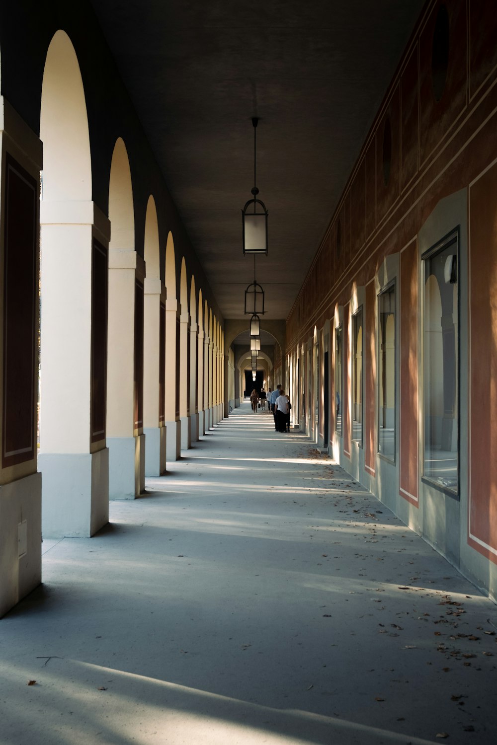 a long hallway with people walking