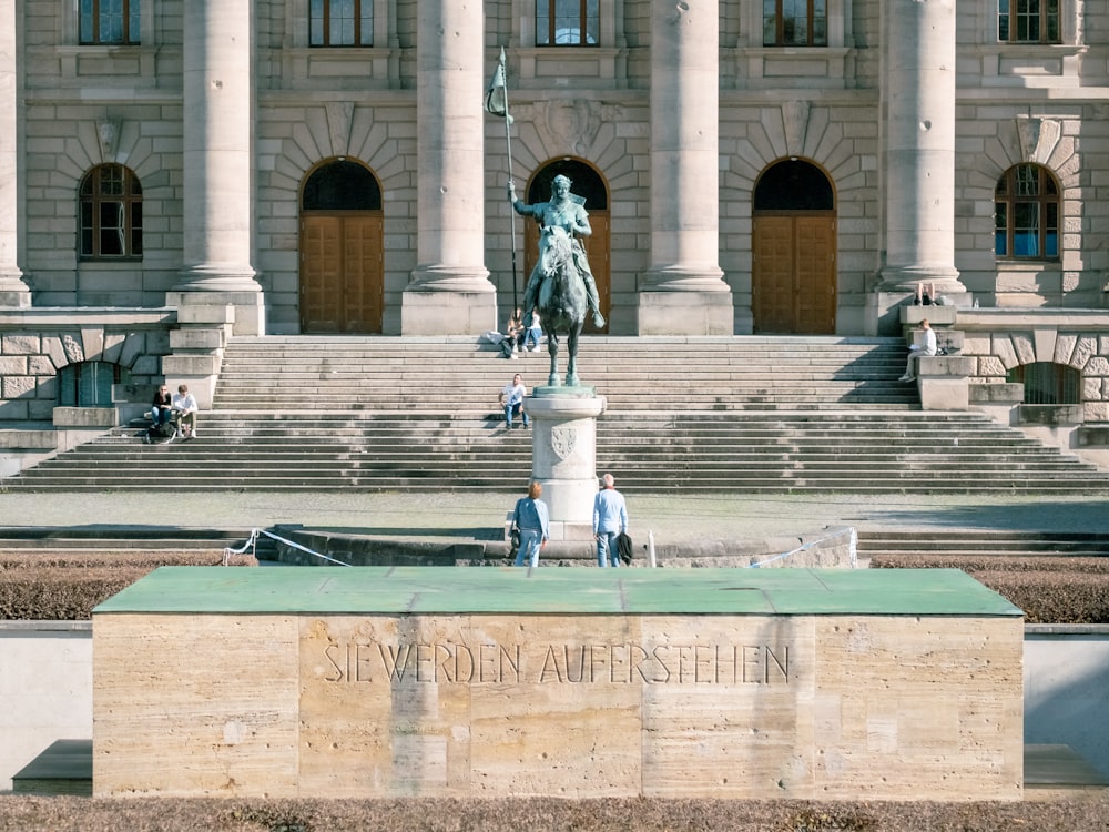 a statue in front of a building