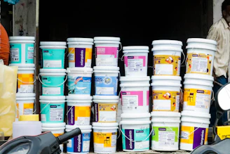 a group of white containers with blue and yellow labels