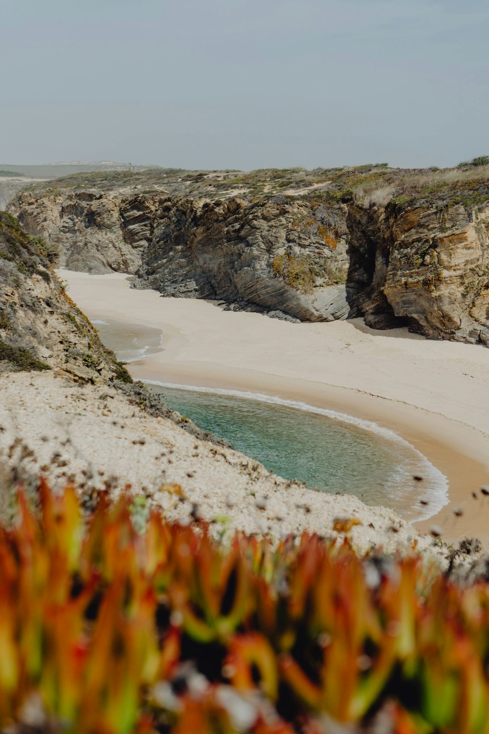 a beach with a body of water