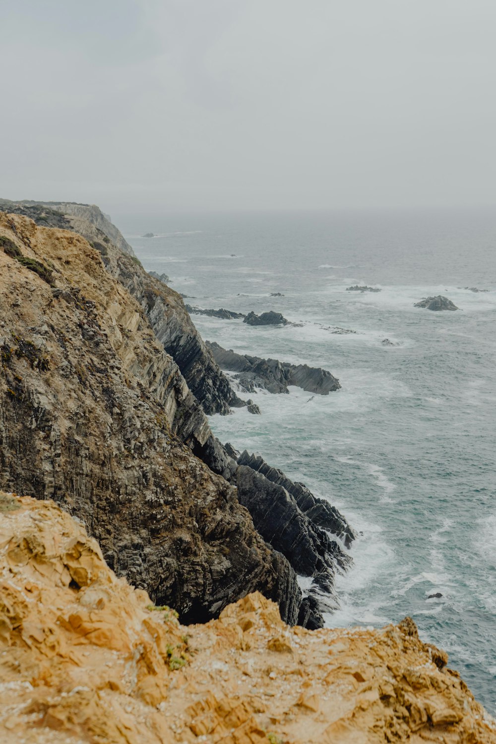 a rocky cliff overlooking the ocean