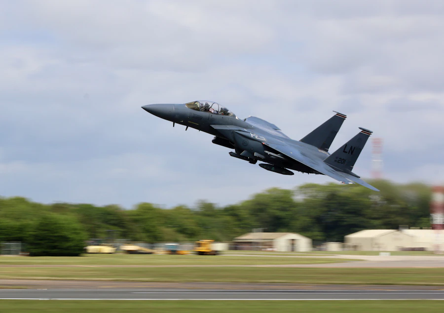 A fighter jet above a runway
