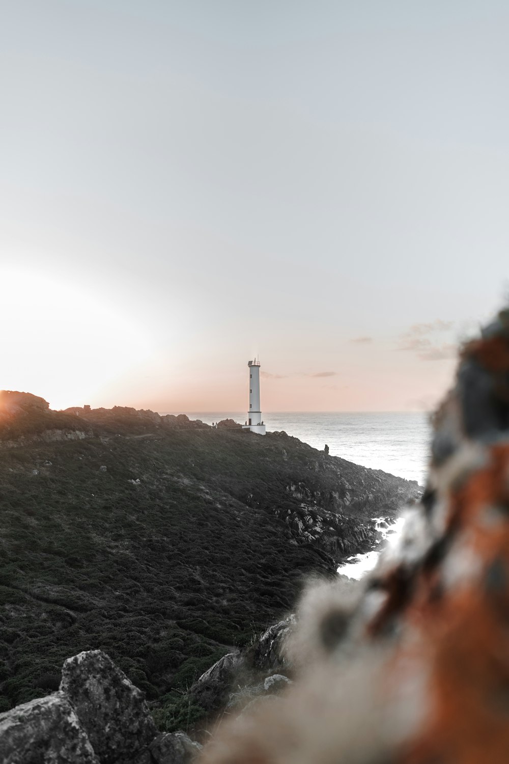 a lighthouse on a hill