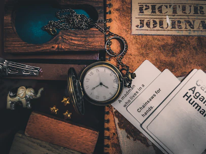 a clock and a book on a table