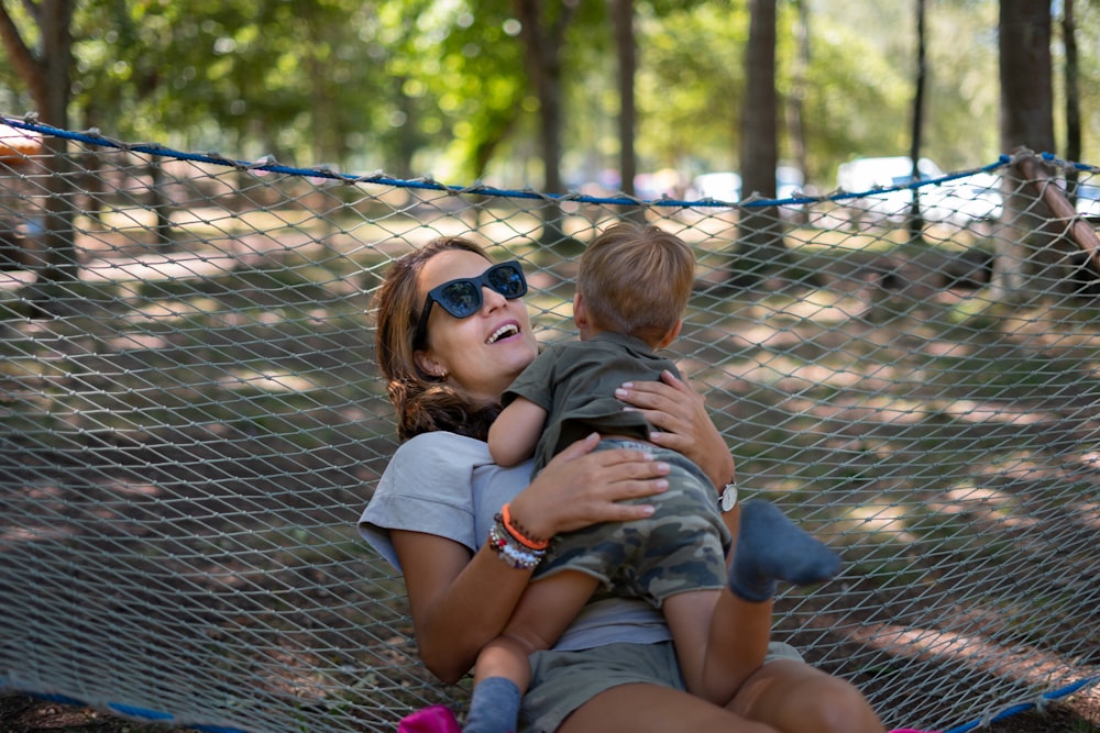 a woman holding a baby